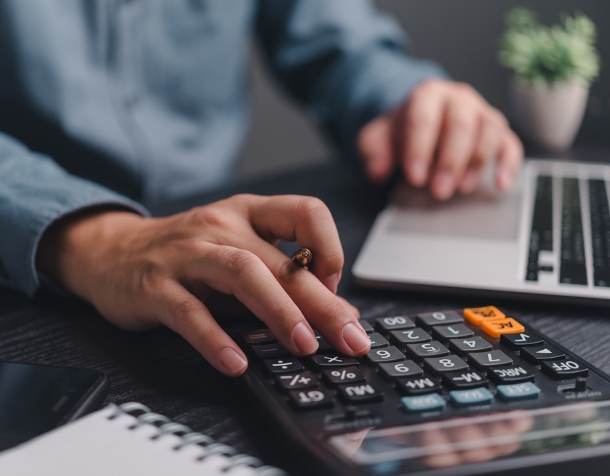 Marketing Your Payroll Company - man with computer and calculator